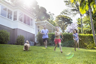 Family and dog in backyard